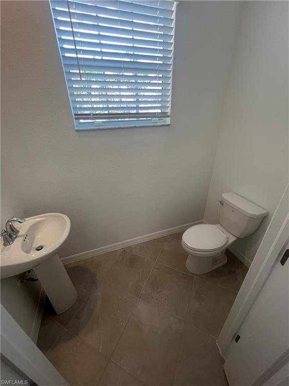 2971 Citrus Street Naples, FL 34120 - Photo 9 of 42 a bathroom with a toilet