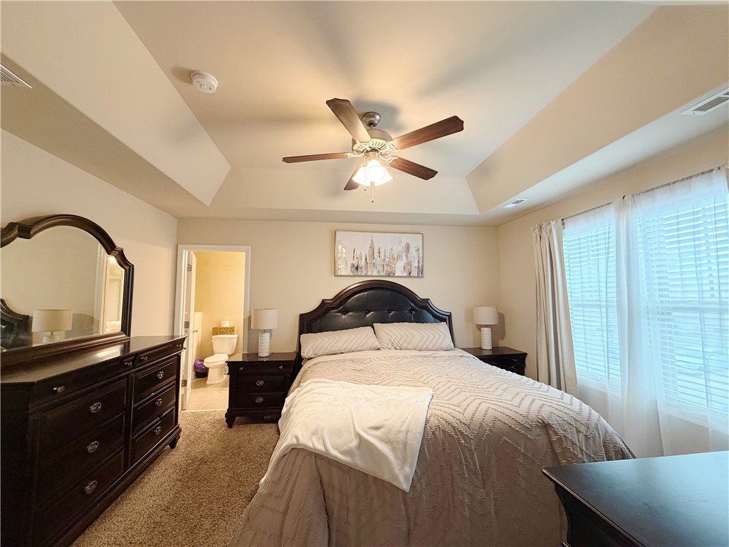 874 Wild Orchard Lane Woodruff, SC 29388 - Photo 8 of 12 This restful primary bedroom offers a private retreat for ultimate comfort and relaxation.