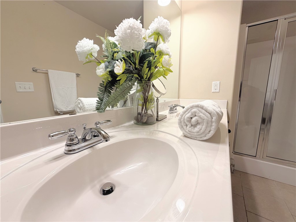 874 Wild Orchard Lane Woodruff, SC 29388 - Photo 9 of 12 This bathroom offers a sleek vanity, modern fixtures, and ample lighting for a refreshing daily routine.