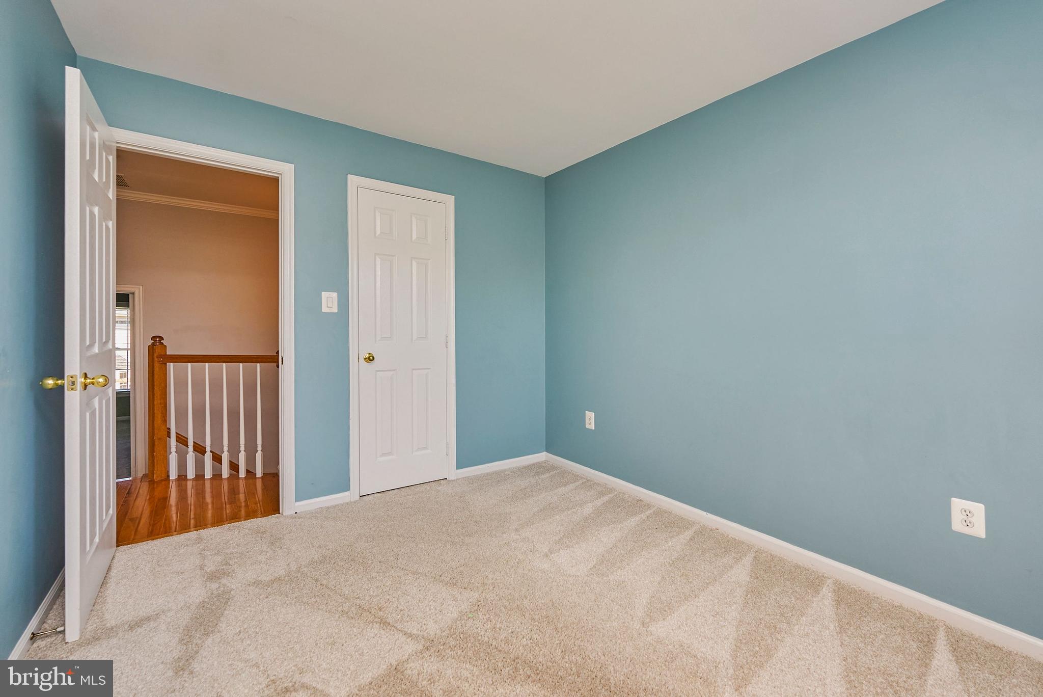 20340 Brentmeade Terrace Sterling, VA 20165 - Photo 18 of 43 a view of a hallway with wooden floor and entryway