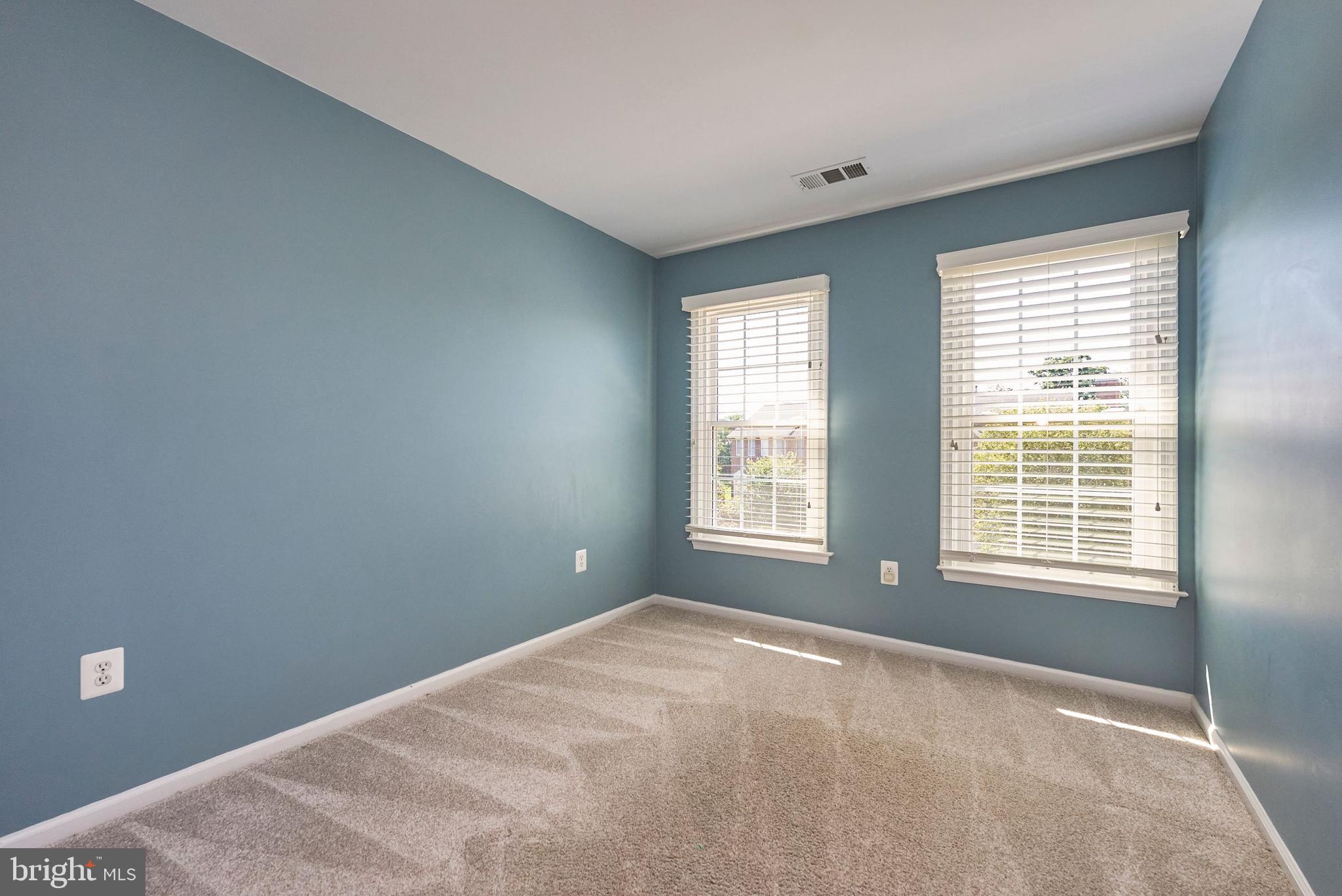 20340 Brentmeade Terrace Sterling, VA 20165 - Photo 19 of 43 a bedroom with a bed and a window