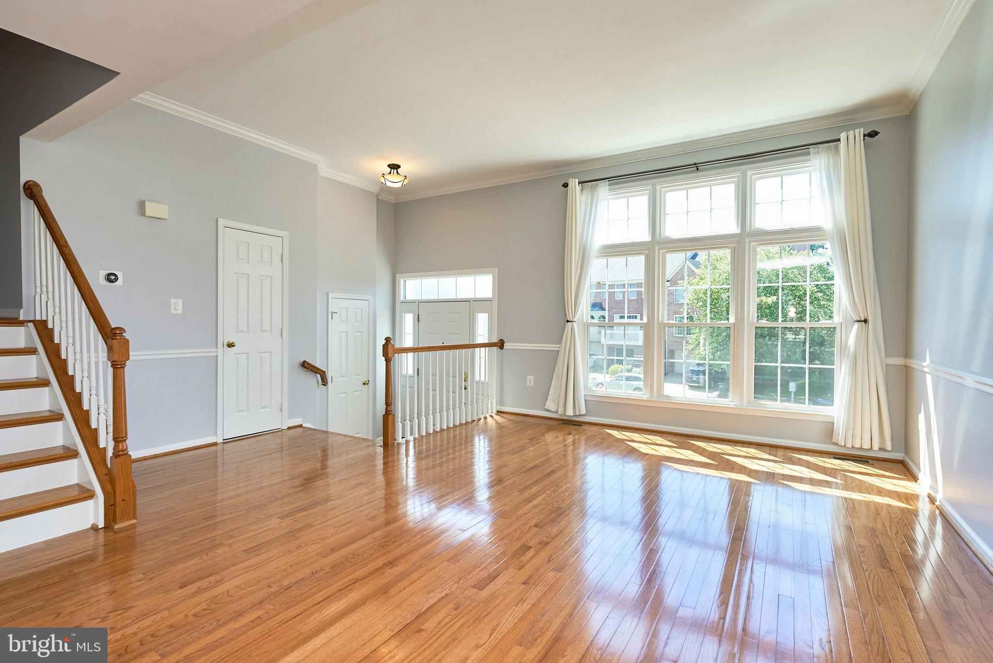 20340 Brentmeade Terrace Sterling, VA 20165 - Photo 2 of 43 a view of empty room with wooden floor and fan