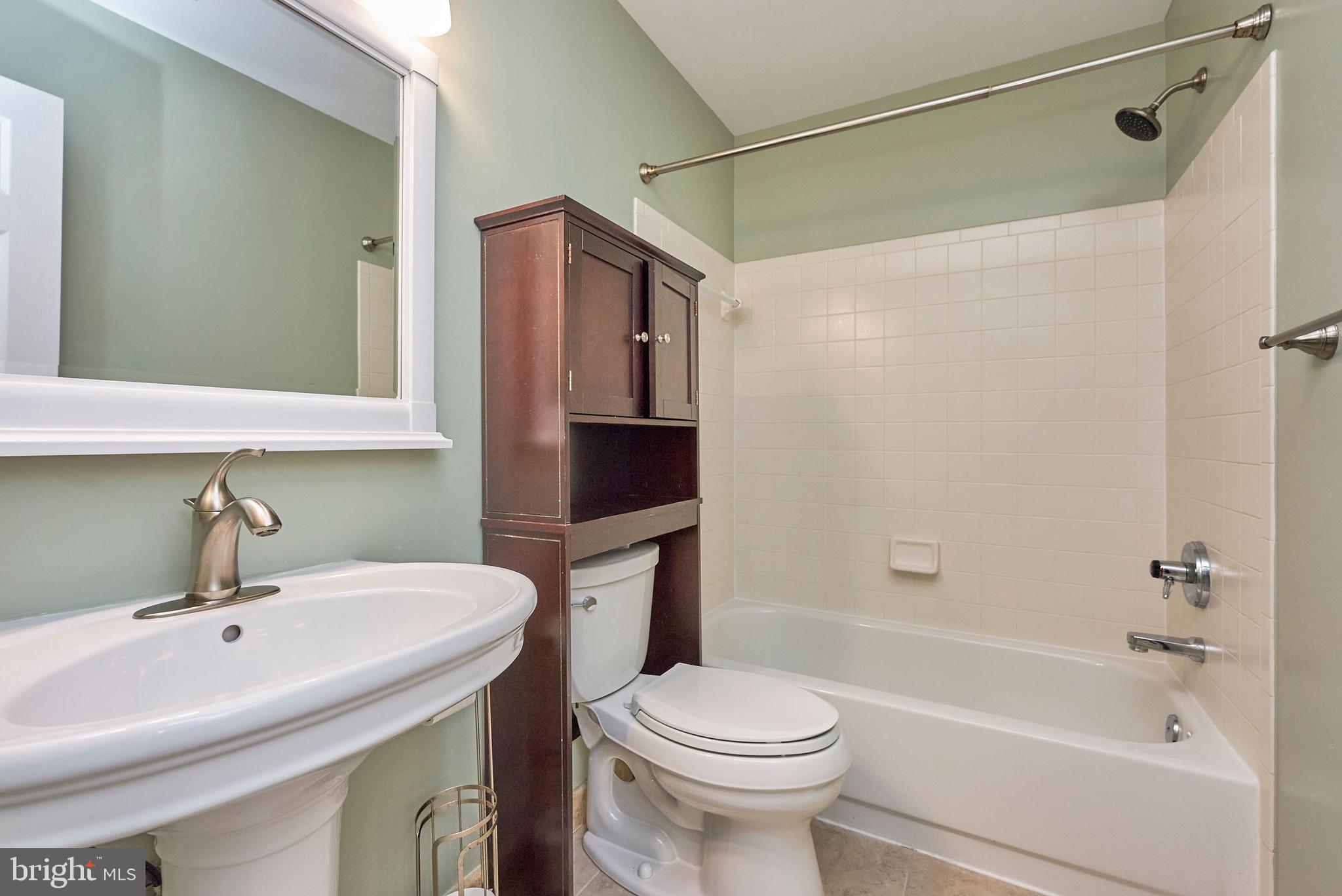 20340 Brentmeade Terrace Sterling, VA 20165 - Photo 24 of 43 a bathroom with a sink toilet and shower
