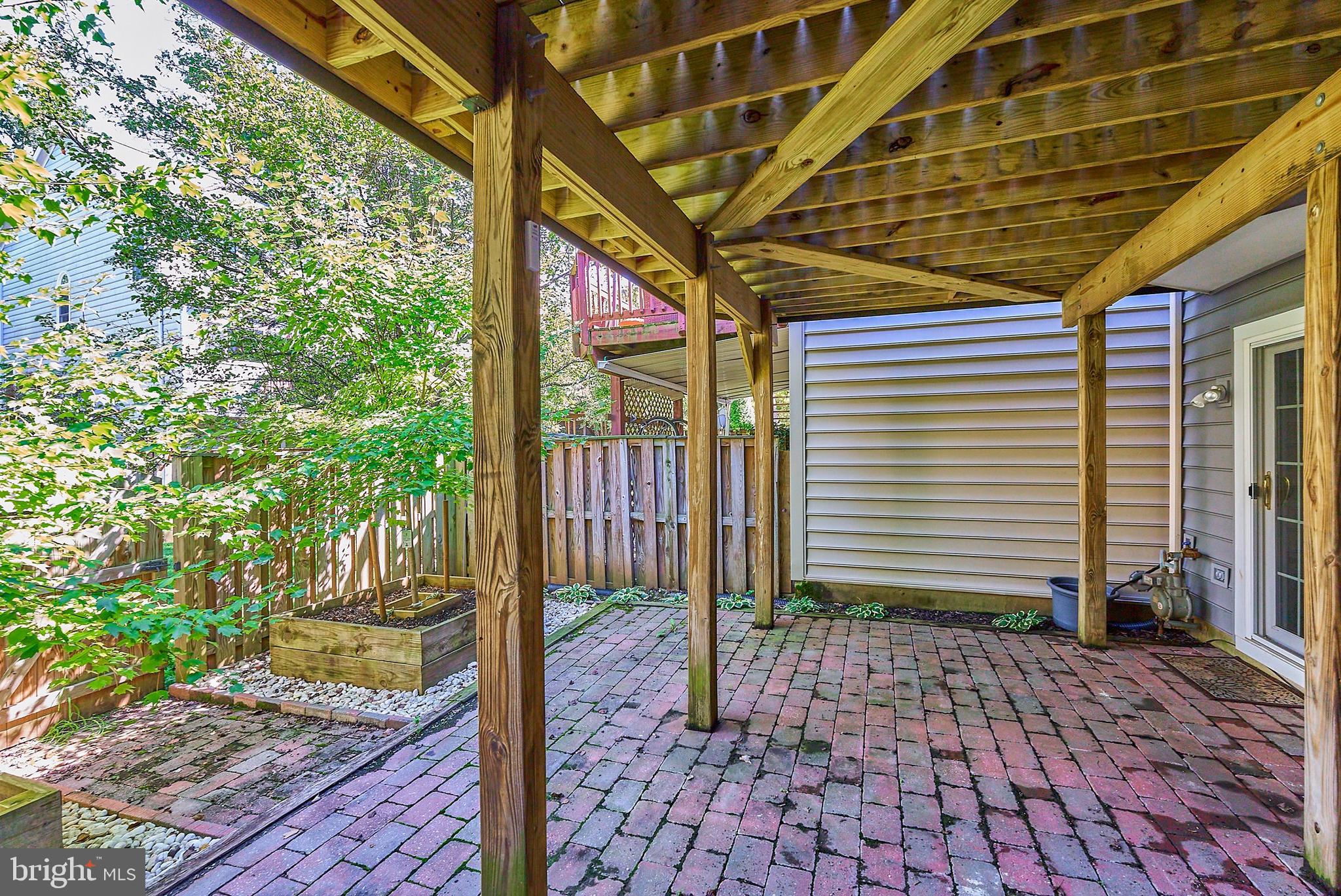 20340 Brentmeade Terrace Sterling, VA 20165 - Photo 26 of 43 a porch with view of a backyard
