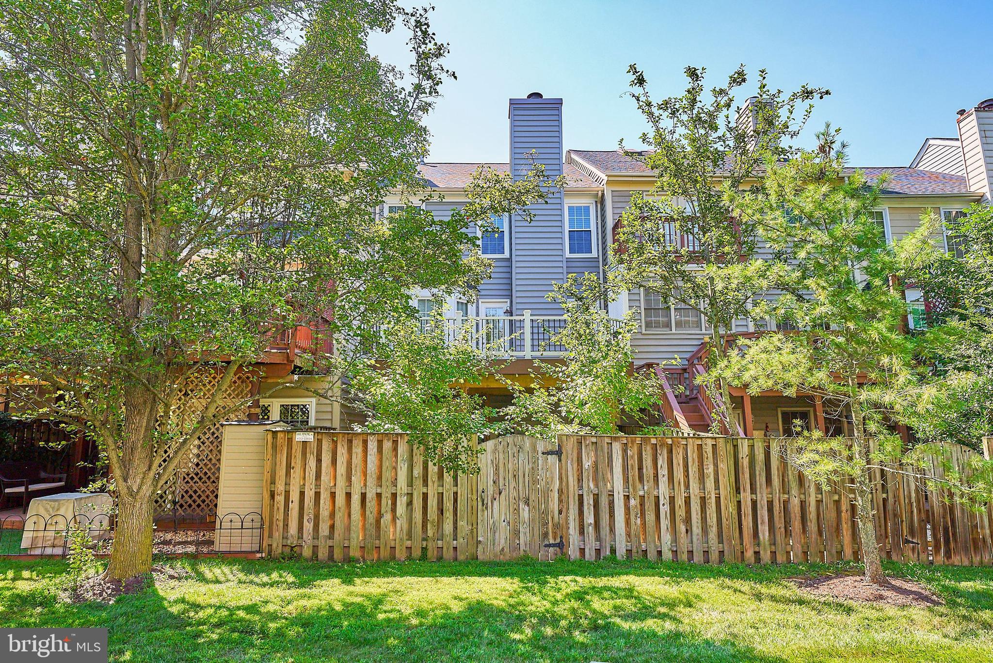 20340 Brentmeade Terrace Sterling, VA 20165 - Photo 30 of 43 a green field with trees in front of it