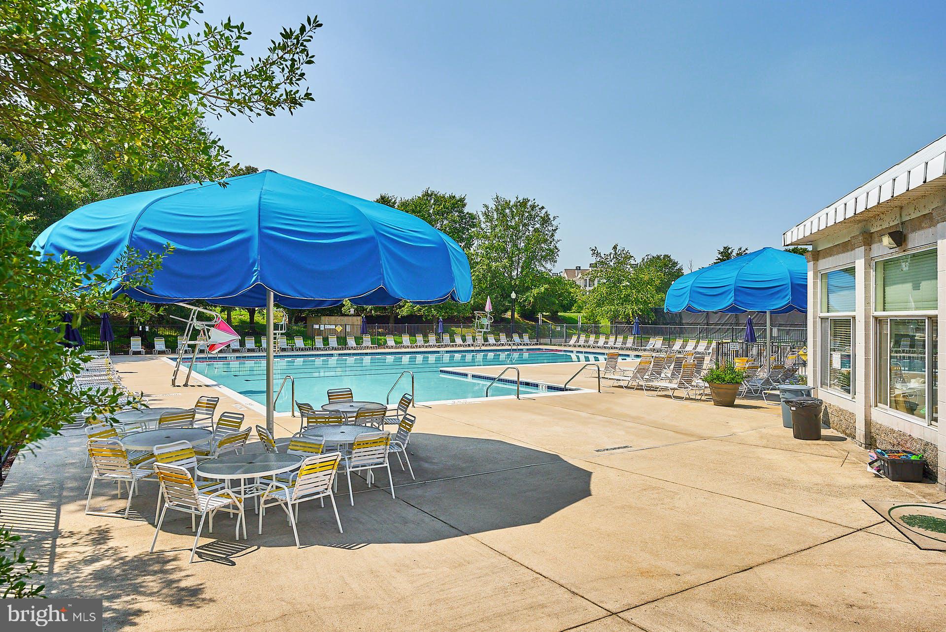 20340 Brentmeade Terrace Sterling, VA 20165 - Photo 41 of 43 a patio with a table and chairs