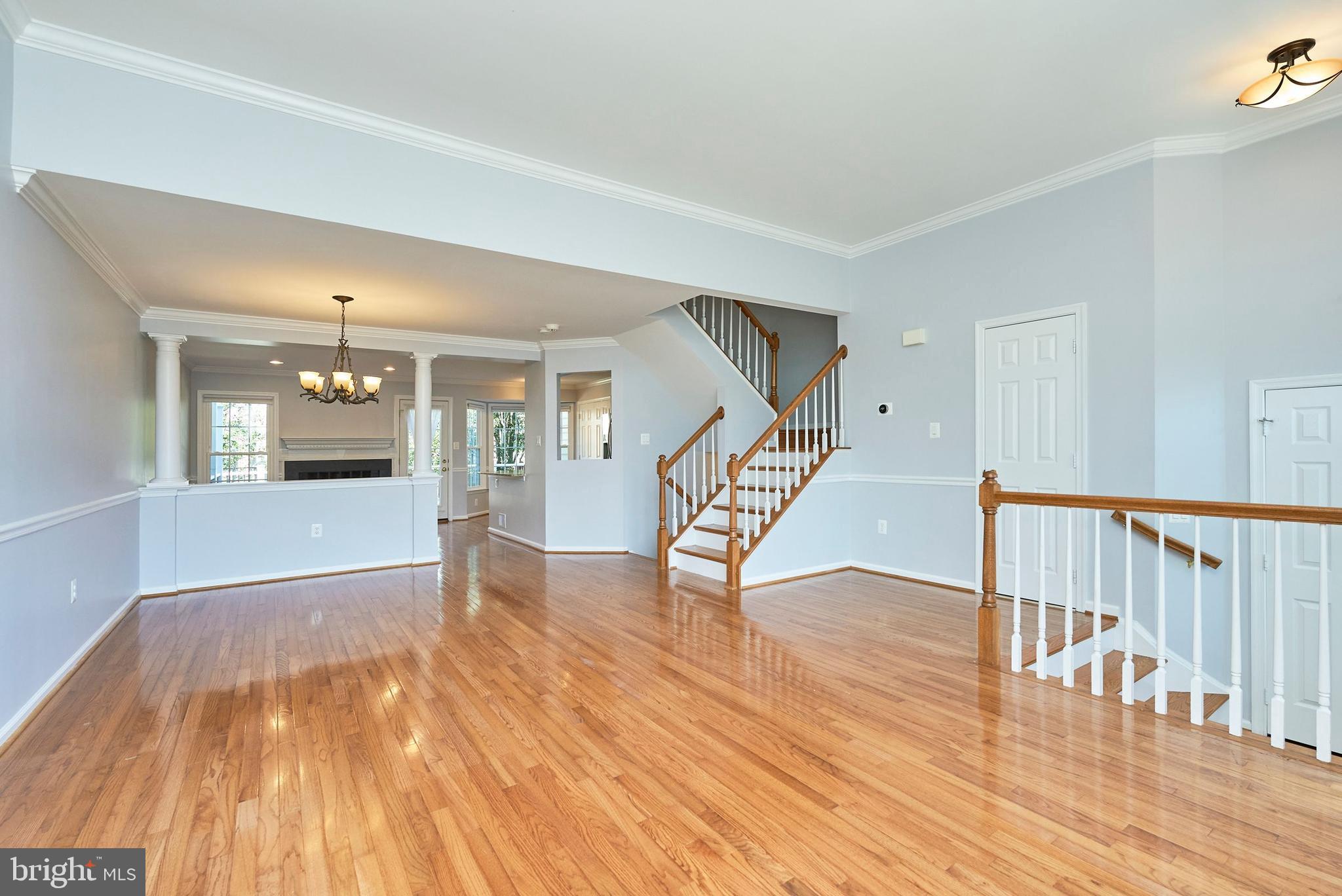 20340 Brentmeade Terrace Sterling, VA 20165 - Photo 8 of 43 wooden floor in an empty room with a window