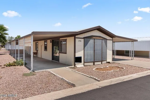 a view of a house with a sink and a yard