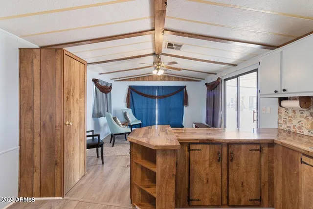 a kitchen with a refrigerator and a window