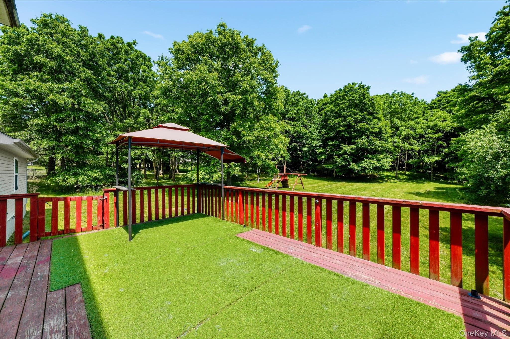 5 Horton Road Washingtonville, NY 10992 - Photo 12 of 42 a view of a wooden deck in the backyard