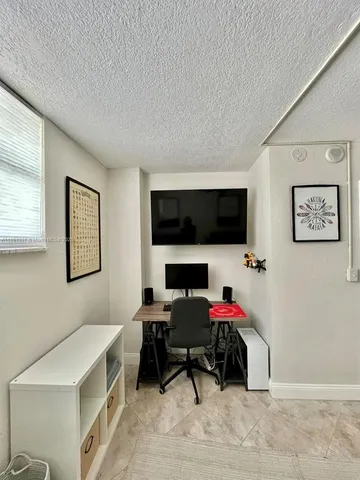 a bedroom with a workspace