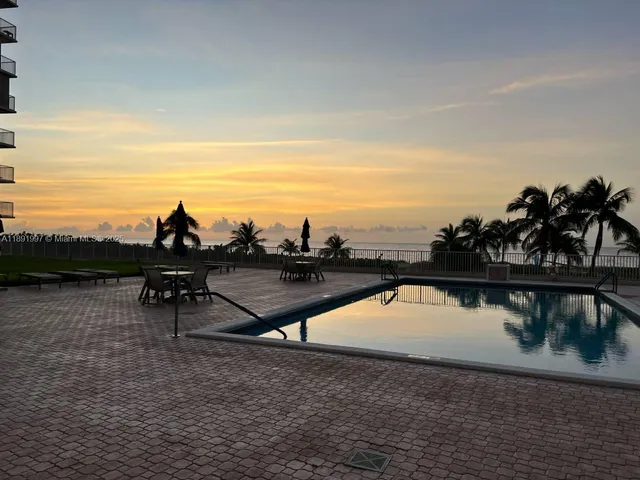 a view of a lake with a yard