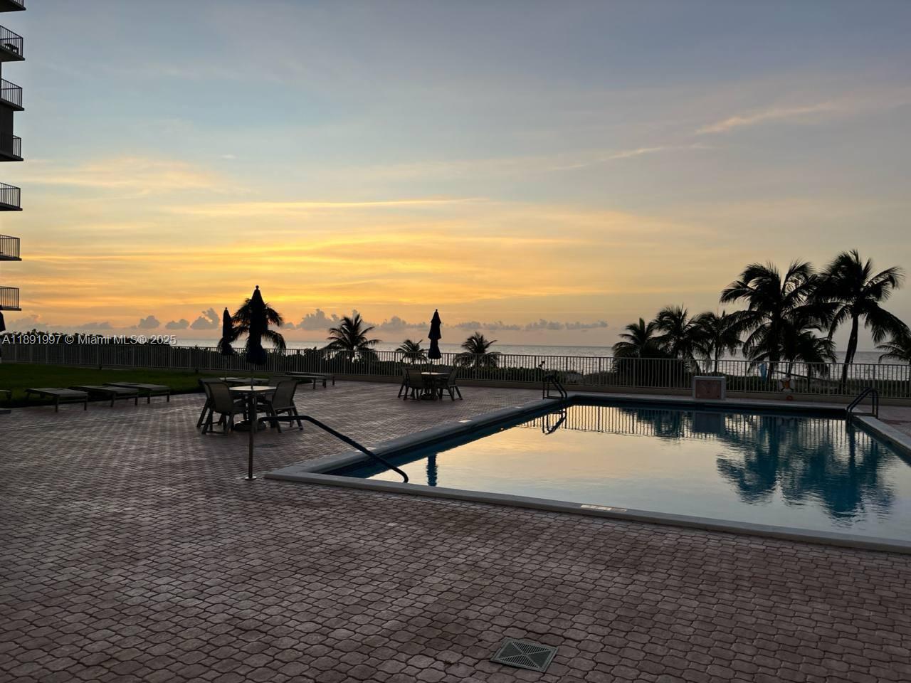 750 North Ocean Boulevard, Unit 905 Pompano Beach, FL 33062 - Photo 25 of 29 a view of swimming pool with outdoor seating and lake view