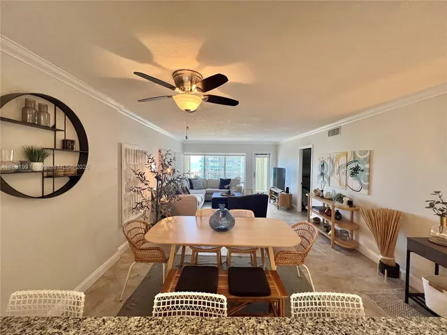 a view of a dining room with furniture