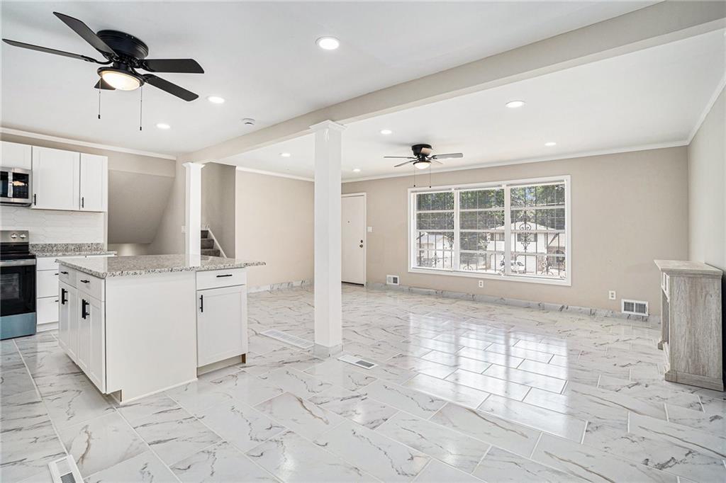 2403 Tiffany Place Decatur, GA 30035 - Photo 11 of 29 a large white kitchen with a stove a sink dishwasher and a refrigerator