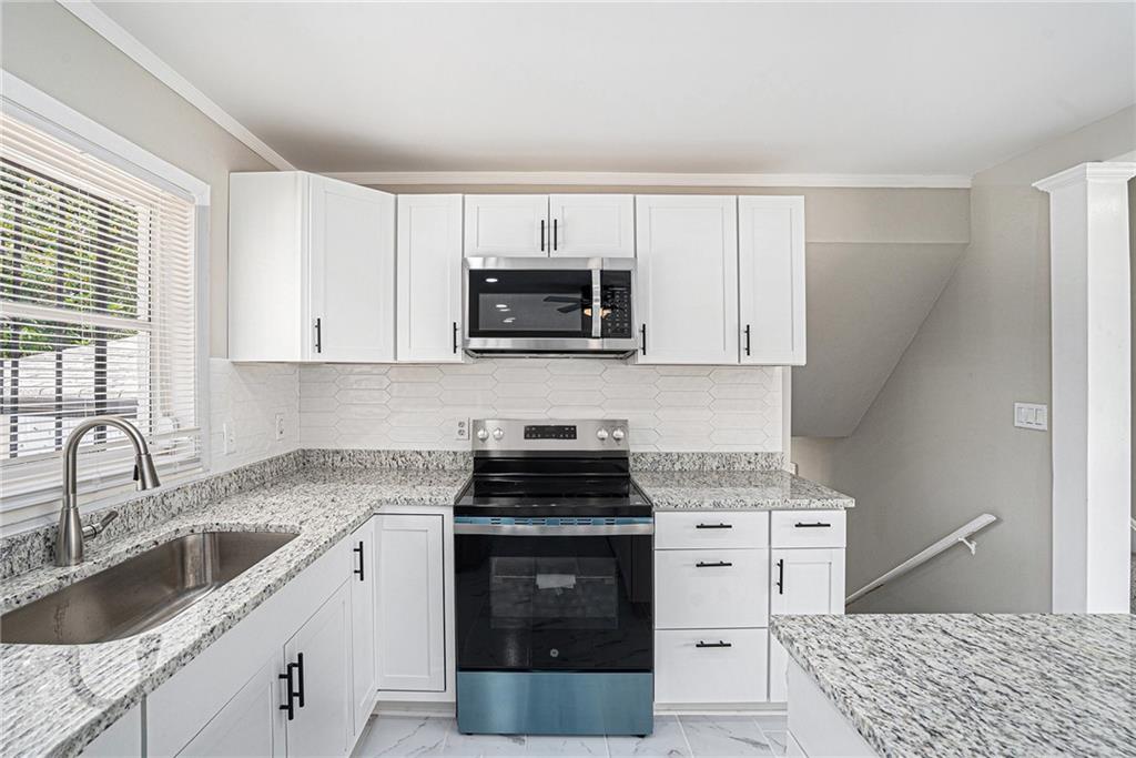 2403 Tiffany Place Decatur, GA 30035 - Photo 13 of 29 a kitchen with a sink stove and microwave