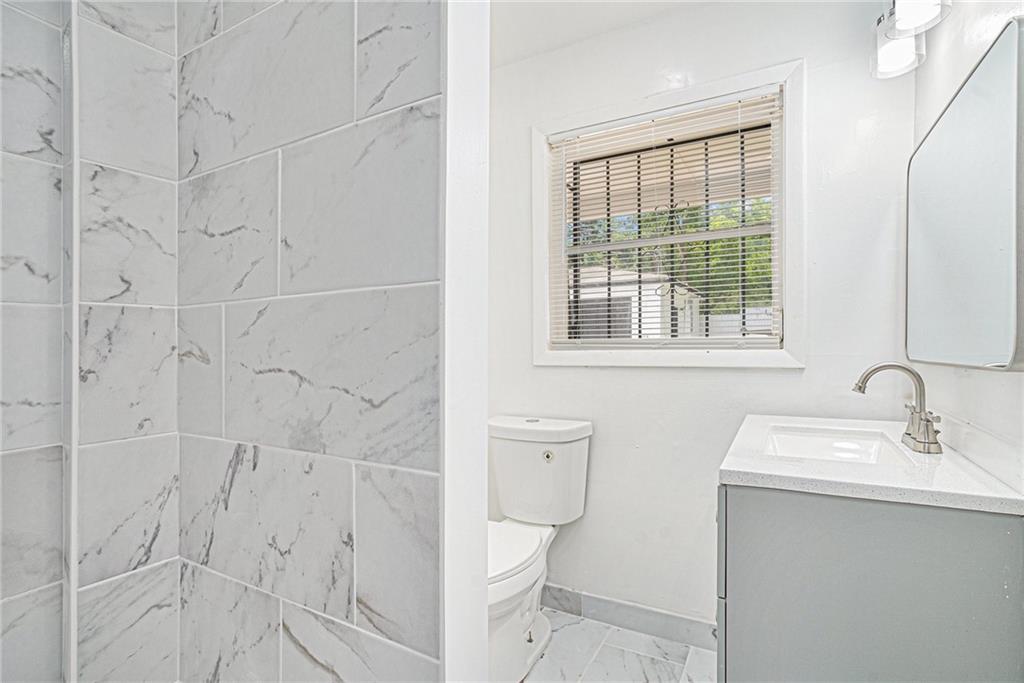 2403 Tiffany Place Decatur, GA 30035 - Photo 16 of 29 a bathroom with a sink toilet and shower