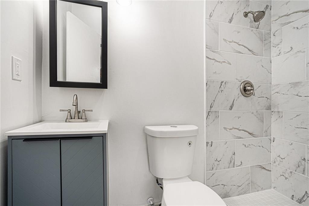 2403 Tiffany Place Decatur, GA 30035 - Photo 21 of 29 a bathroom with a toilet sink and mirror