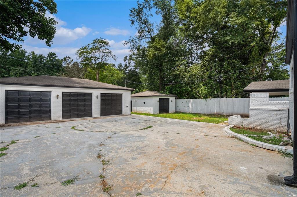2403 Tiffany Place Decatur, GA 30035 - Photo 4 of 29 a front view of a house with a yard and garage