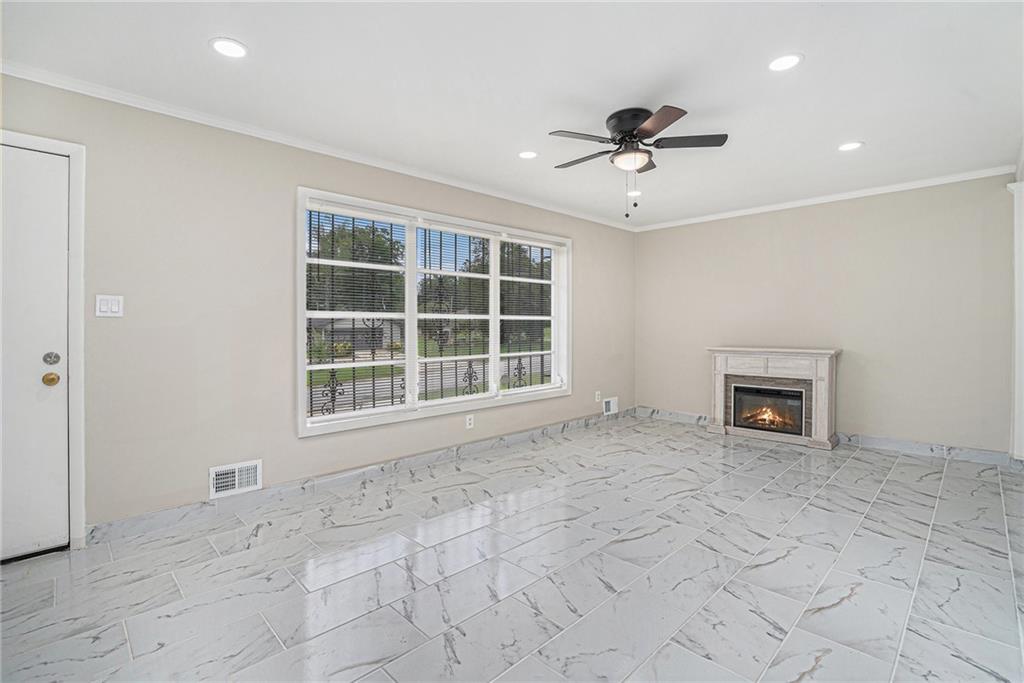 2403 Tiffany Place Decatur, GA 30035 - Photo 9 of 29 a view of an empty room with a window and a fireplace