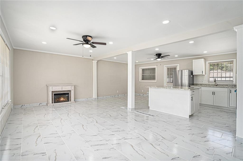 2403 Tiffany Place Decatur, GA 30035 - Photo 10 of 29 a view of a kitchen with a sink and a fireplace