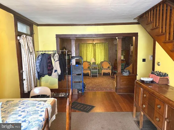 a dining room with furniture and a window