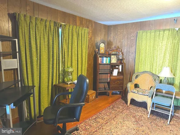 a workspace with furniture and a window