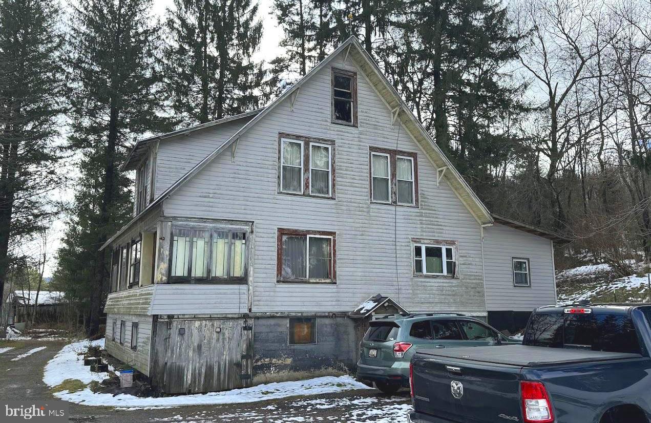 511 Main Street Oakland, MD 21550 - Photo 2 of 10 a front view of a house with a yard