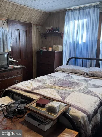 a bedroom with a bed and a walk in closet