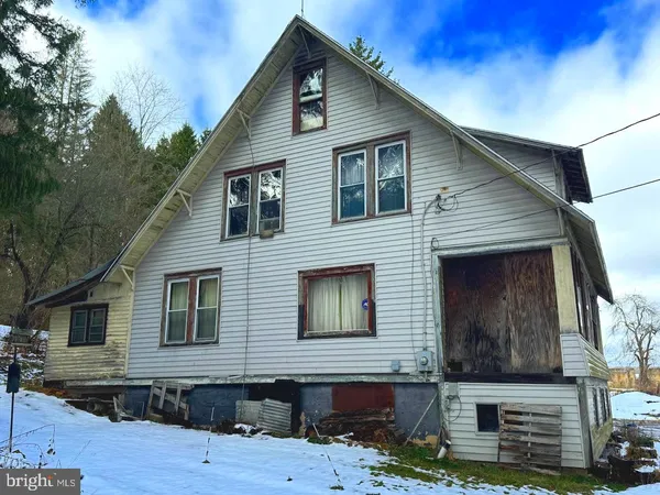 a front view of a house with garage