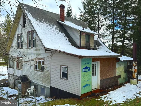 a front view of a house with garage