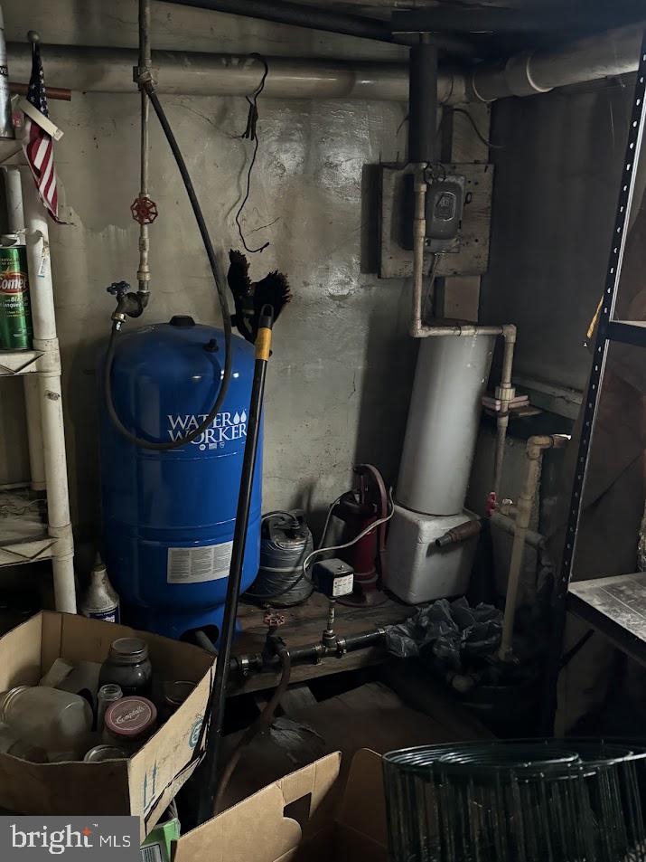 511 Main Street Oakland, MD 21550 - Photo 9 of 10 a room with water heater and utility racks