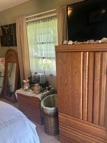 a room with a bunk bed and a dresser