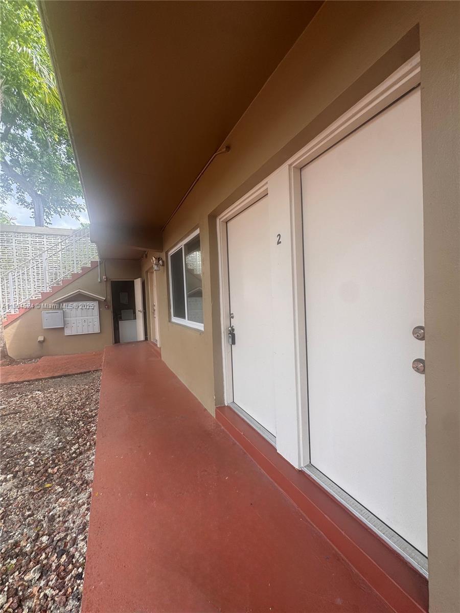 6310 Southwest 79th Street, Unit 2 South Miami, FL 33143 - Photo 8 of 8 a view of a house with a porch