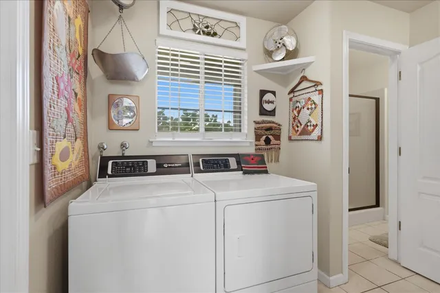 a dining room with furniture a rug and wooden floor