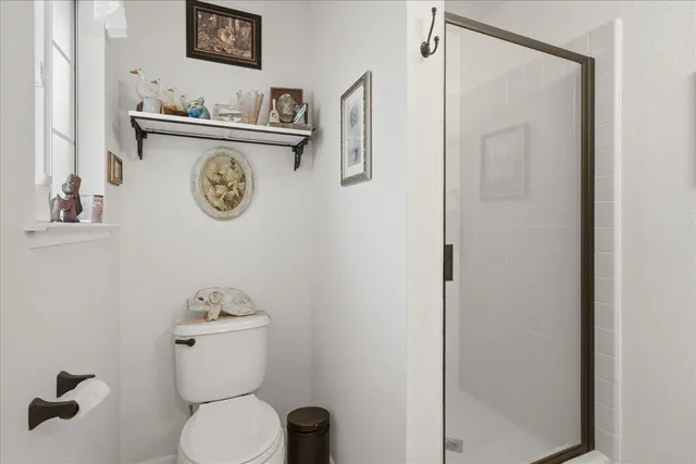 a bedroom with furniture and flat screen tv