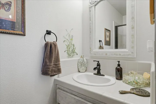 a bathroom with a sink and a mirror