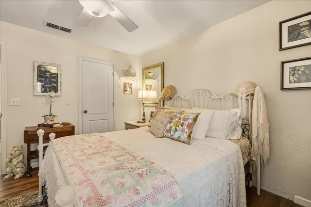 a view of a patio with a table and chairs under an umbrella