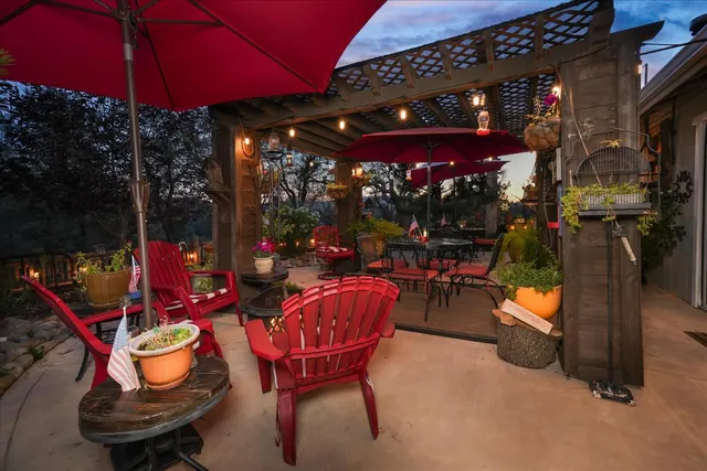 an aerial view of a house with an outdoor space swimming pool