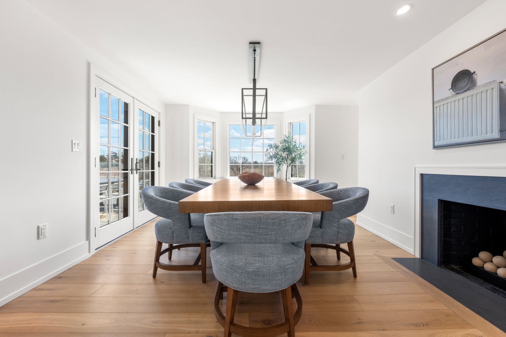 174 Cliff Road Nantucket, MA 02554 - Photo 12 of 49 a view of a dining room with furniture window and wooden floor