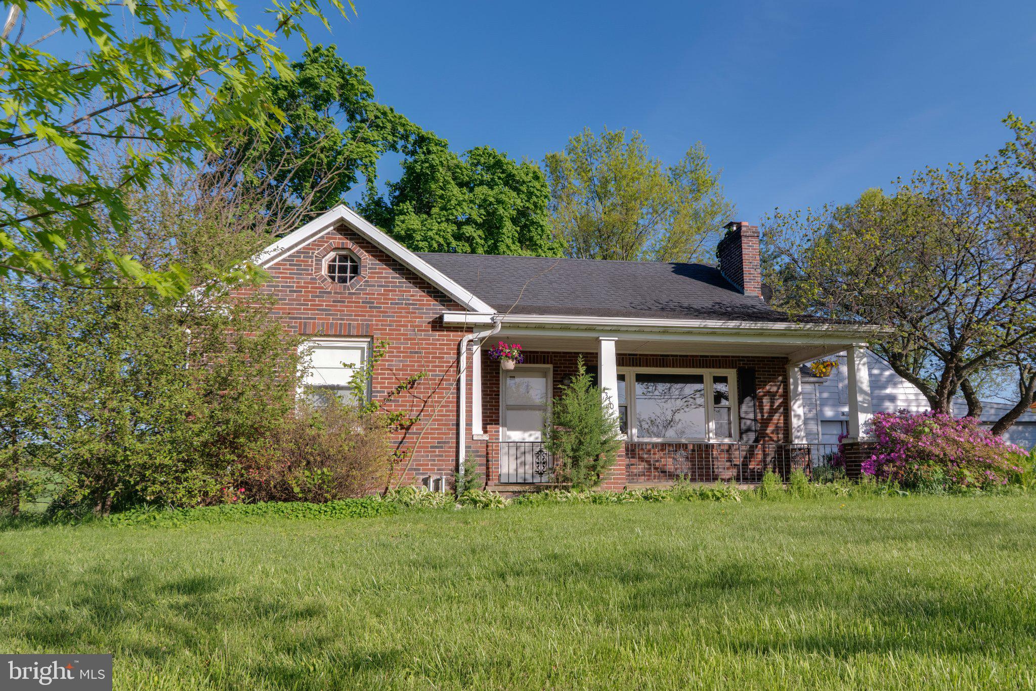 4330 Paradise Road Dover, PA 17315 - Photo 11 of 23 Charming brick home with lush greenery.