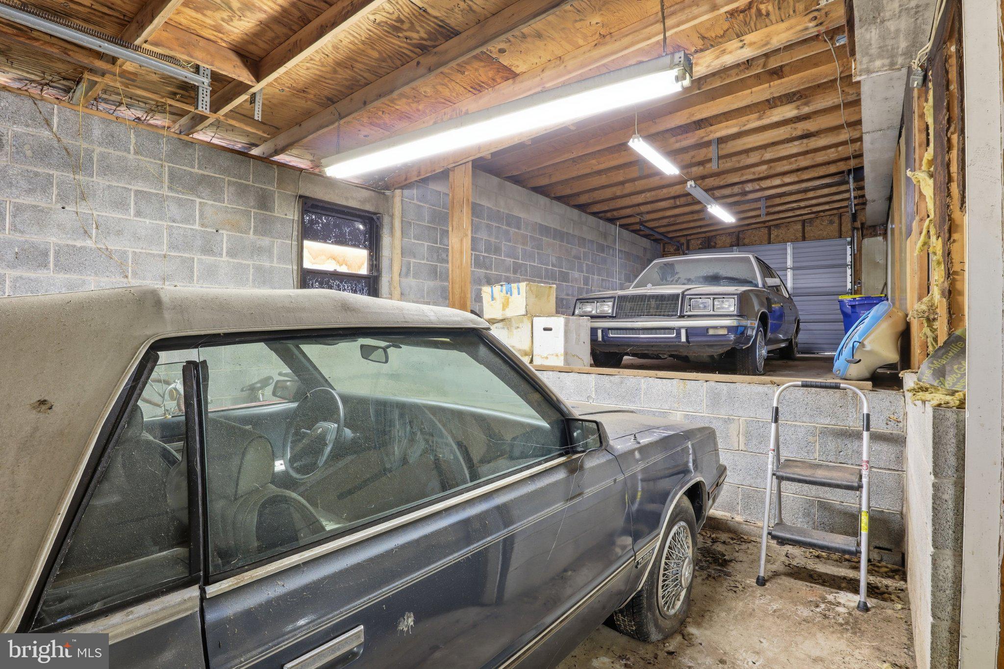 4330 Paradise Road Dover, PA 17315 - Photo 22 of 23 Classic cars in a spacious garage.