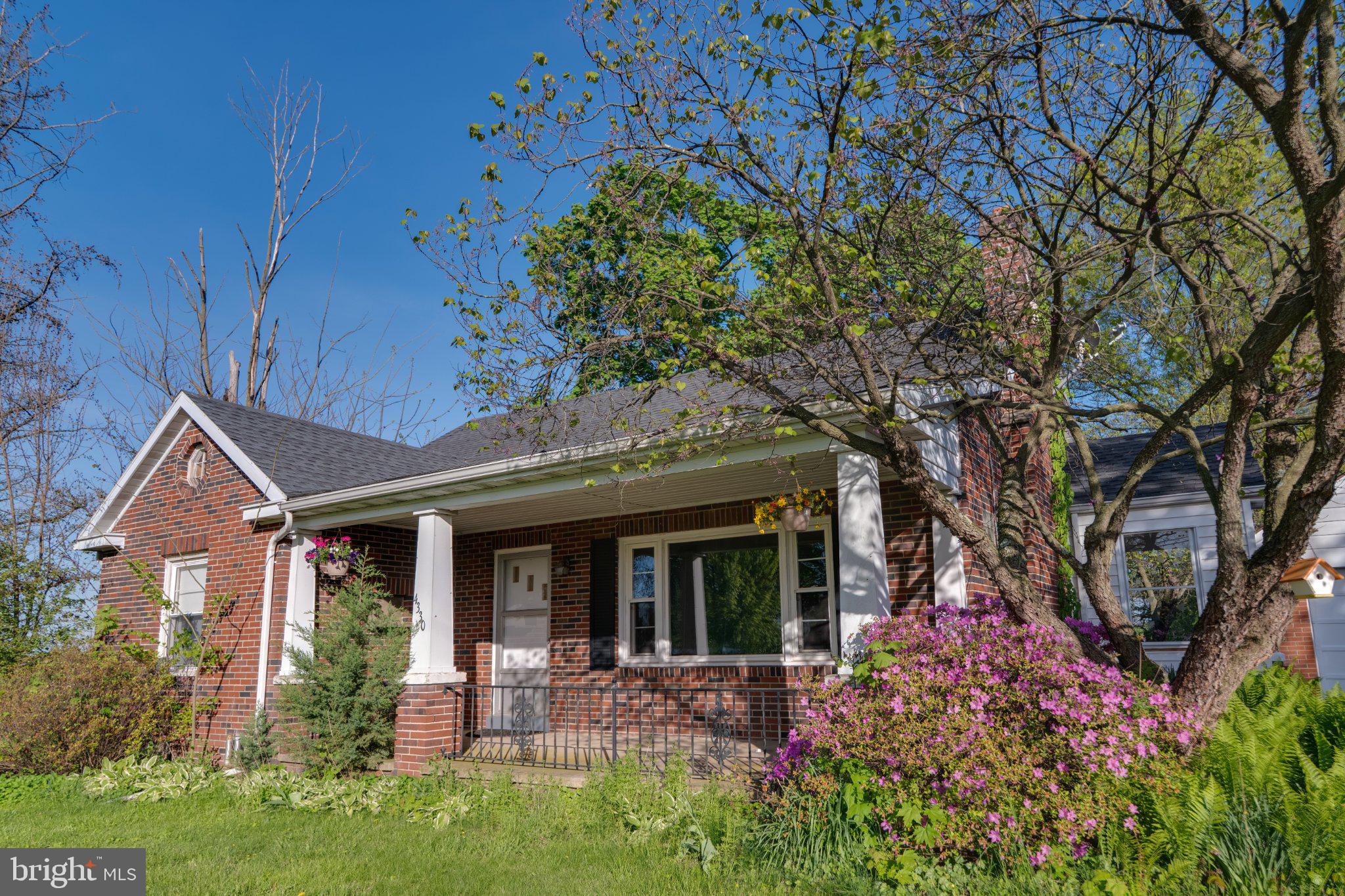 4330 Paradise Road Dover, PA 17315 - Photo 10 of 23 Charming brick home with vibrant blooms.