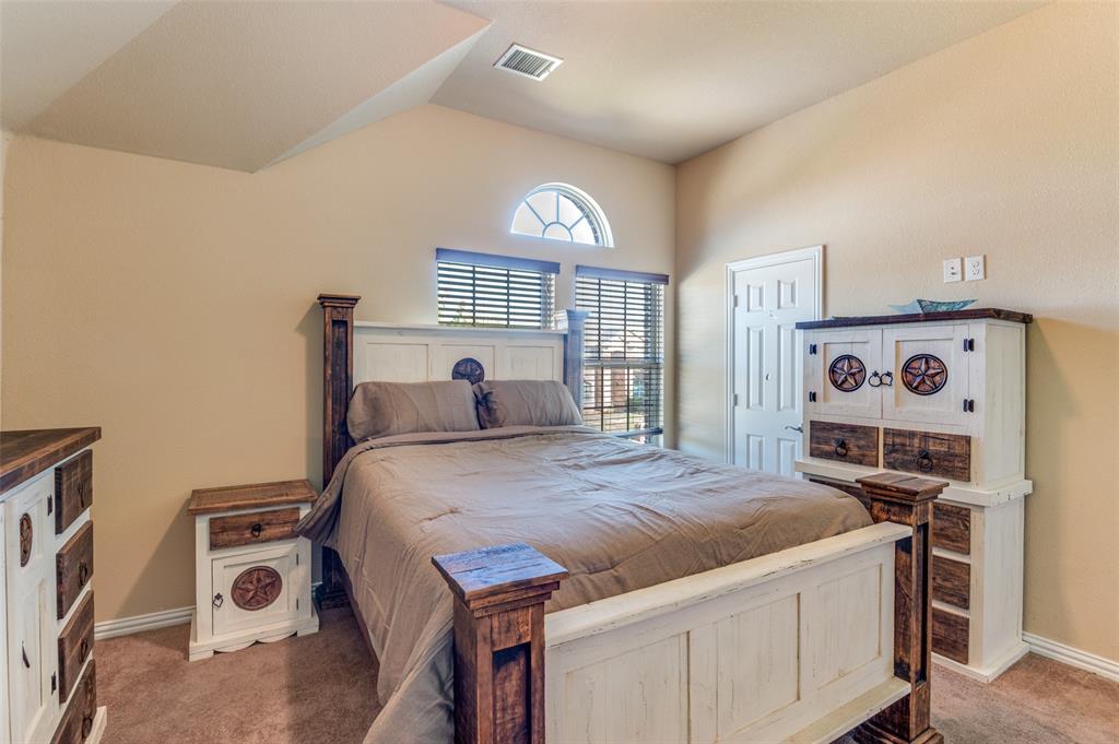 1512 Ruffian Road DeSoto, TX 75115 - Photo 11 of 25 a bed room with a bed and a tv