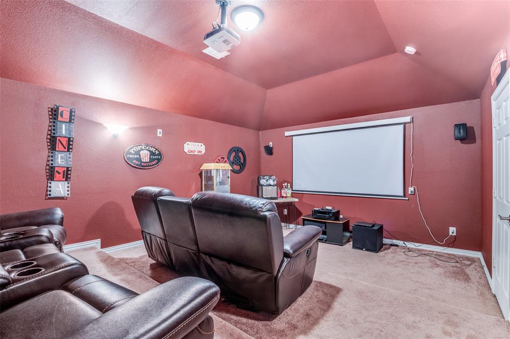 1512 Ruffian Road DeSoto, TX 75115 - Photo 14 of 25 a projector room with furniture