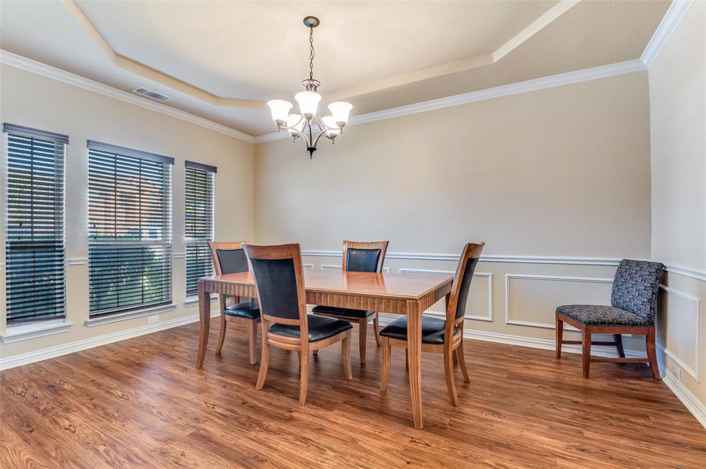 1512 Ruffian Road DeSoto, TX 75115 - Photo 16 of 25 a view of a dining room with furniture window and wooden floor