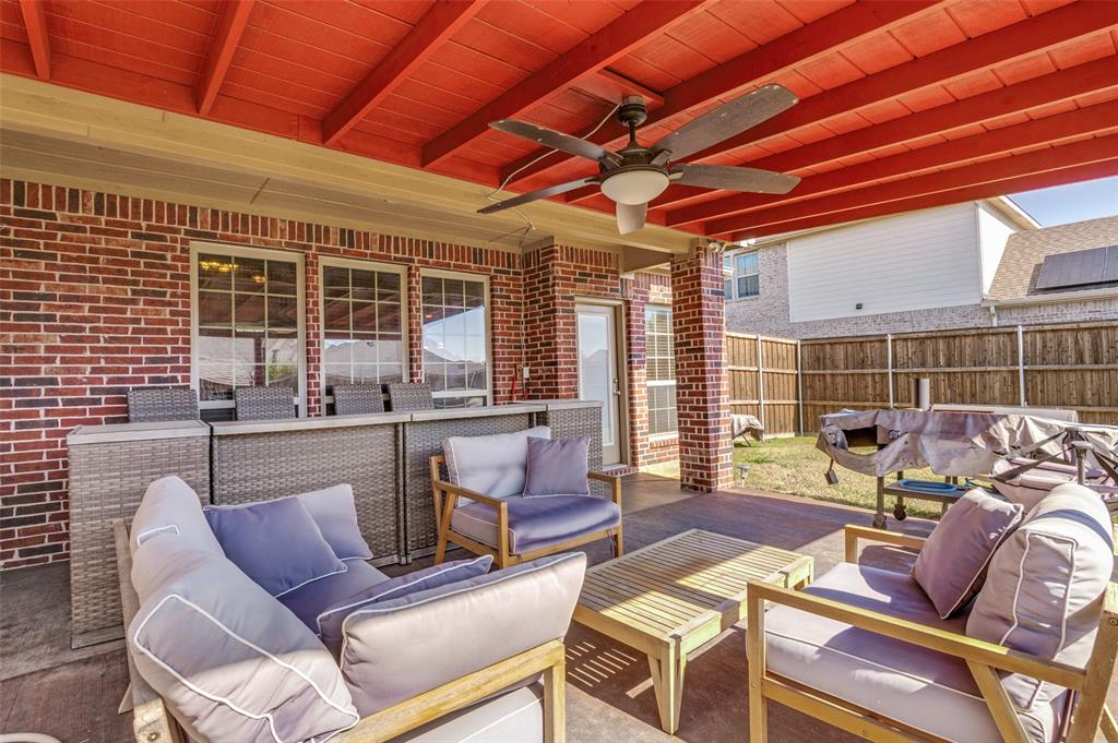 1512 Ruffian Road DeSoto, TX 75115 - Photo 19 of 25 a outdoor living space with patio furniture and garden view