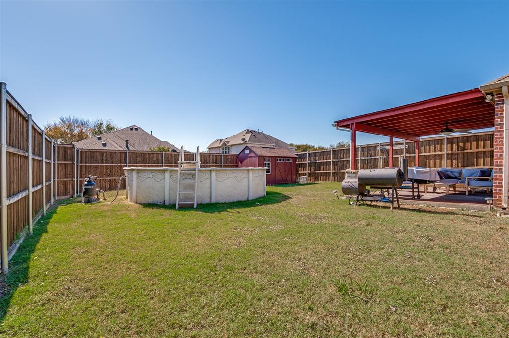 1512 Ruffian Road DeSoto, TX 75115 - Photo 25 of 25 a view of a house with backyard and sitting area