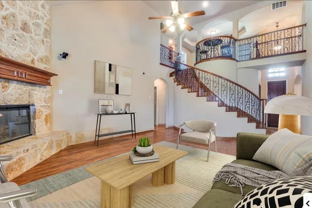 a living room with furniture and a fireplace