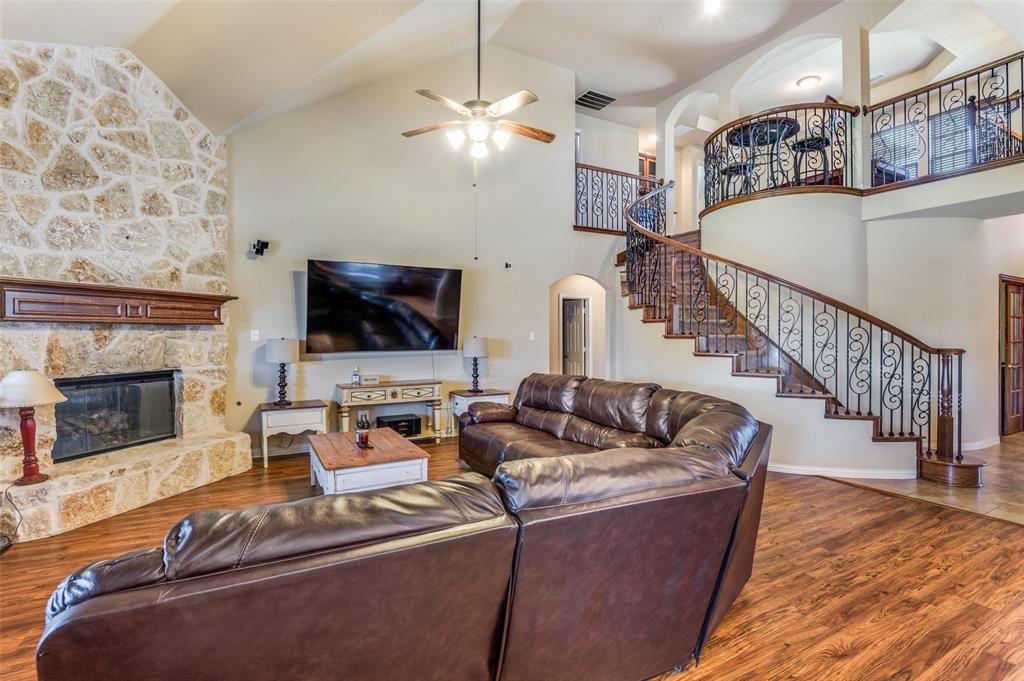 1512 Ruffian Road DeSoto, TX 75115 - Photo 6 of 25 a living room with furniture and a flat screen tv